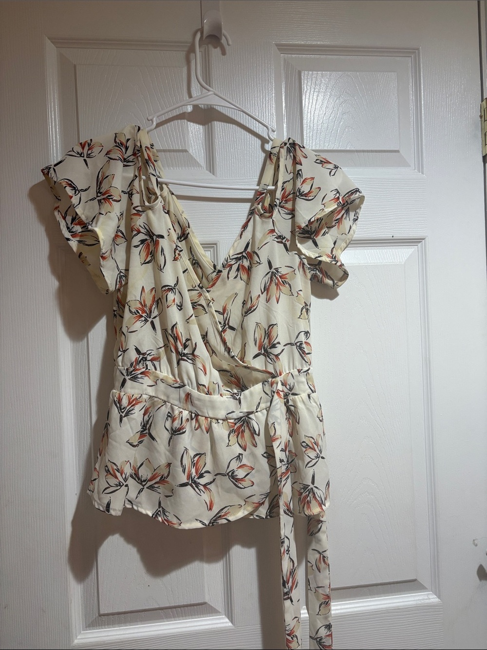 Sienna Sky Cream Floral Wrap Top with Orange & Black Accents